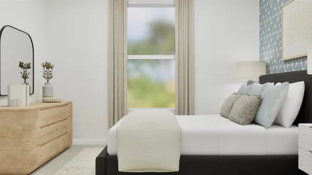 a bedroom with a bed and a mirror