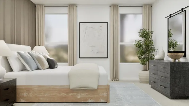 a bedroom with a large bed and a potted plant