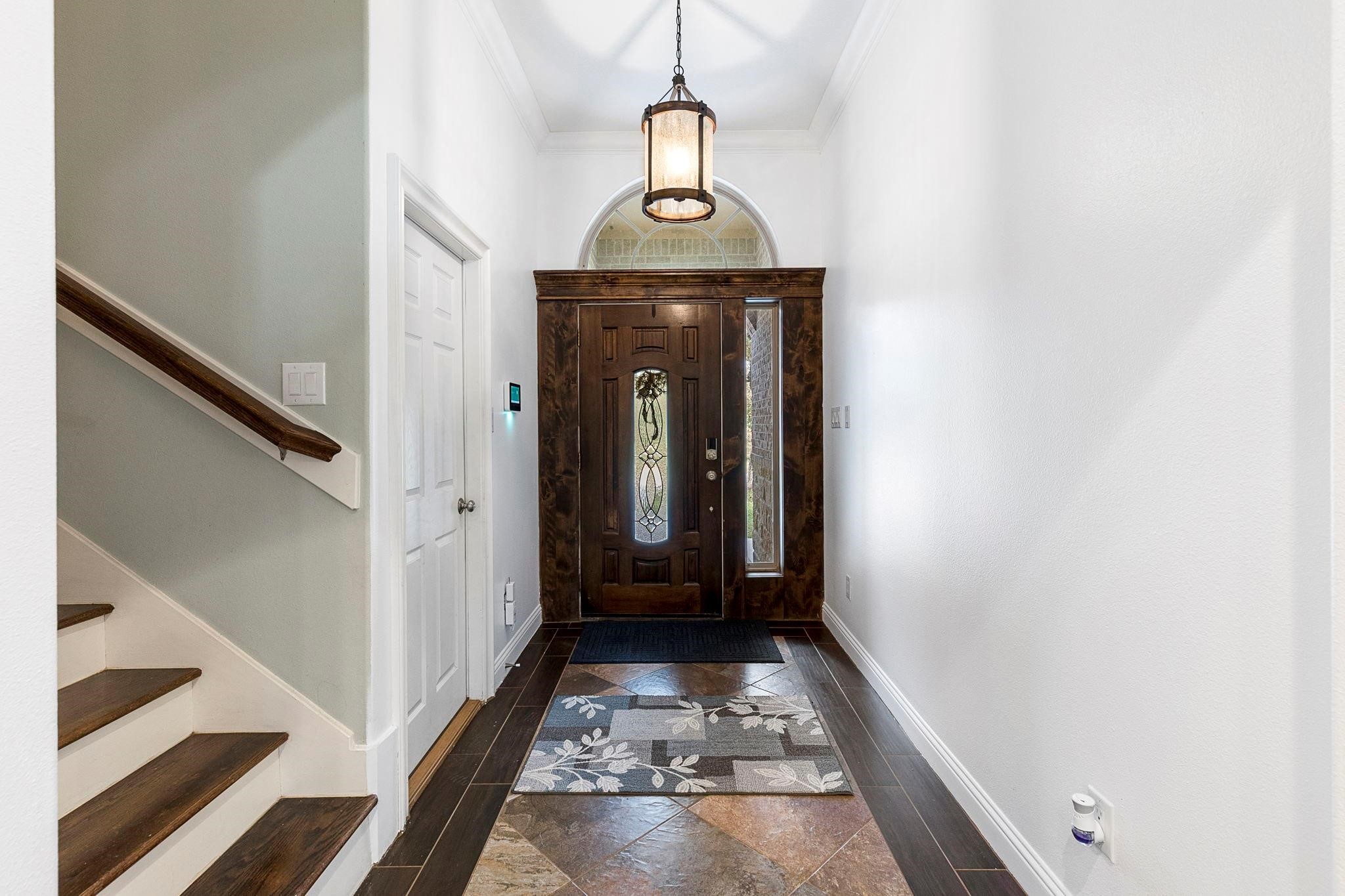 1155 Whipporwill Road Conroe, TX 77303 - Photo 13 of 34 a view of hallway with wooden floor