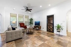 a living room with furniture and a chandelier
