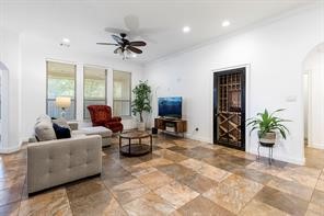 1155 Whipporwill Road Conroe, TX 77303 - Photo 17 of 34 a living room with furniture and a large window