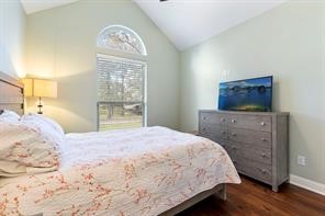 1155 Whipporwill Road Conroe, TX 77303 - Photo 28 of 34 a bedroom with a bed and a tv on the dresser