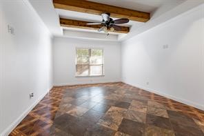 1155 Whipporwill Road Conroe, TX 77303 - Photo 29 of 34 an empty room with windows and fan