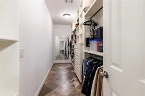 a bathroom with double vanity and a bathtub