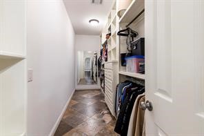 1155 Whipporwill Road Conroe, TX 77303 - Photo 30 of 34 a view of walk in closet with clothes and shoes