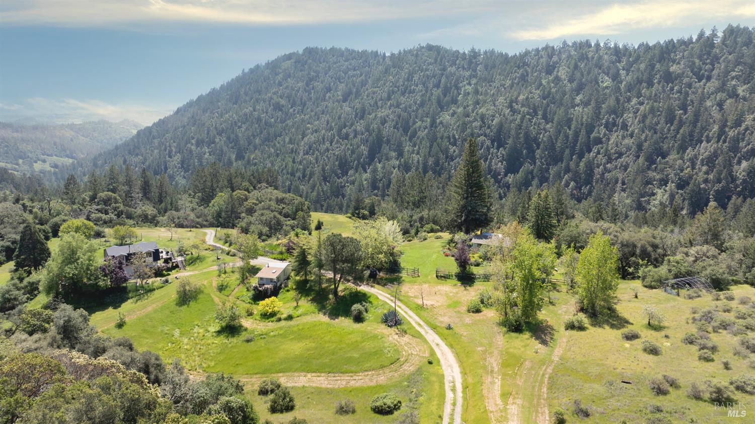10957 Westside Road Healdsburg, CA 95448 - Photo 5 of 30 The Main house, cabin and barn are equipped with solar energy, embracing off-grid living without compromising on comfort.