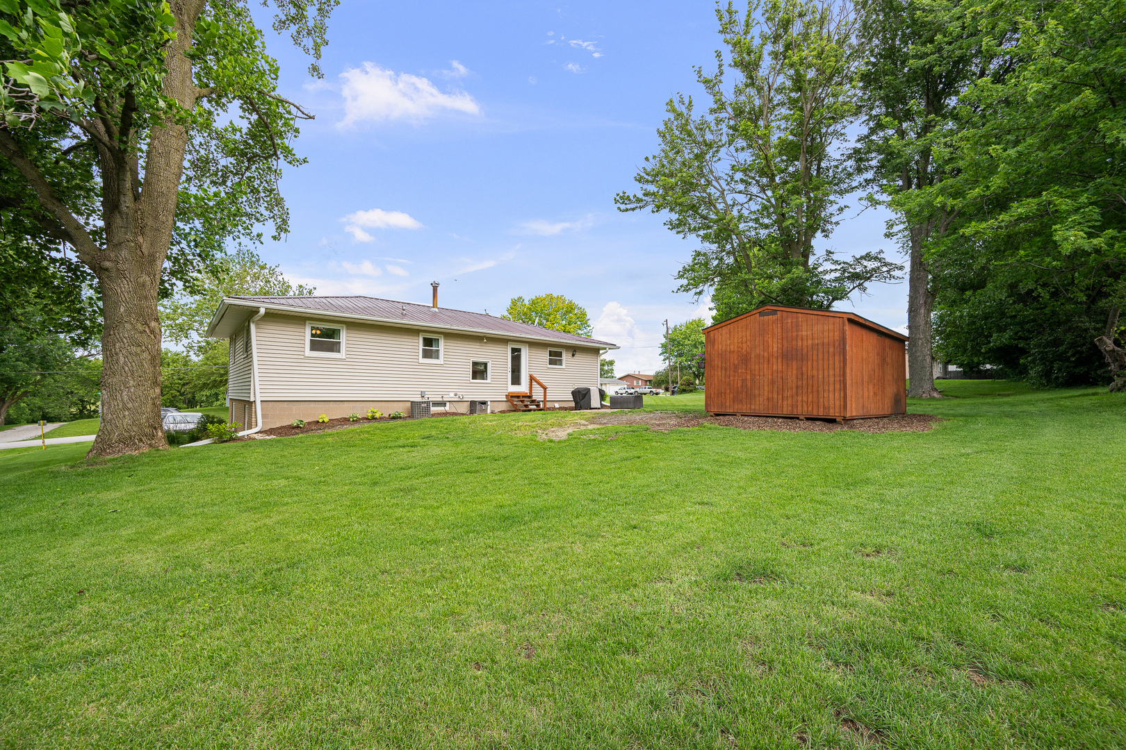 506 Bush Street Reynolds, IL 61279 - Photo 32 of 37 a front view of a house with garden