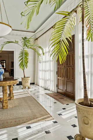 a view of a livingroom with couch and a workspace