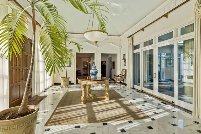 a view of a dining room with furniture and window