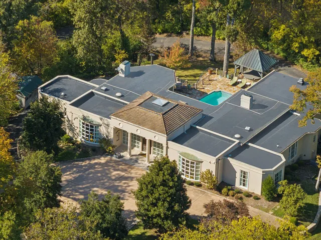 a sign that is on a brick wall