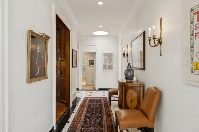 a living room with patio furniture and a large window