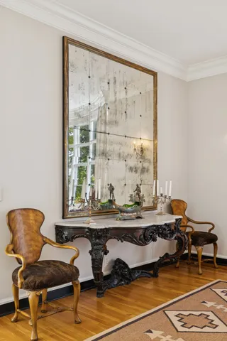 a kitchen with cabinets stainless steel appliances and wooden floor