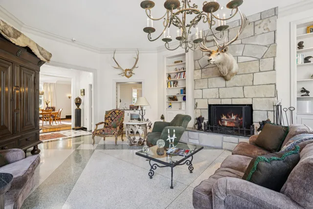 a bedroom with furniture and a window