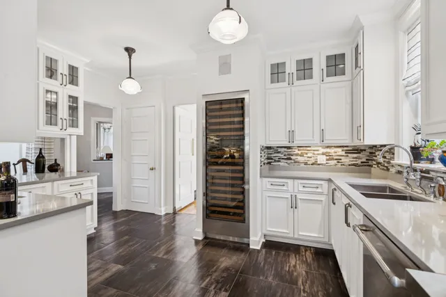 a bathroom with a sink vanity granite and a mirror