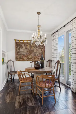 a spacious bedroom with a bed a couch and a window