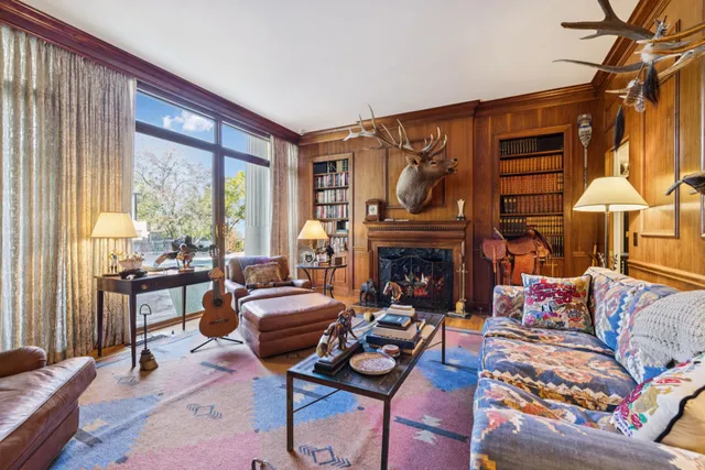 a view of a porch with a table and chairs
