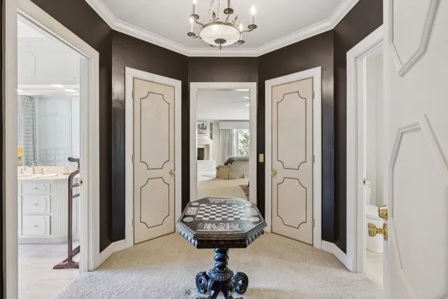 a view of a house with swimming pool and sitting area