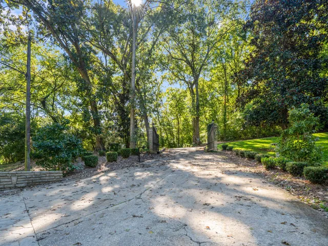 a living room with a couch and a chandelier
