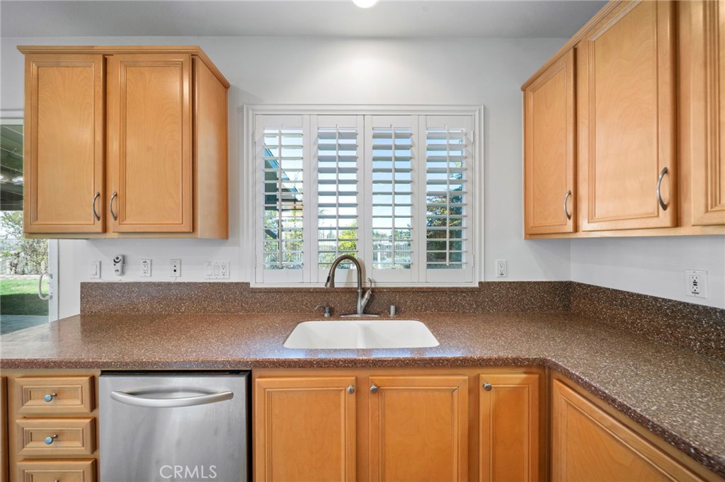 33710 Sattui Street Temecula, CA 92592 - Photo 15 of 75 a kitchen with stainless steel appliances granite countertop a sink and a cabinets