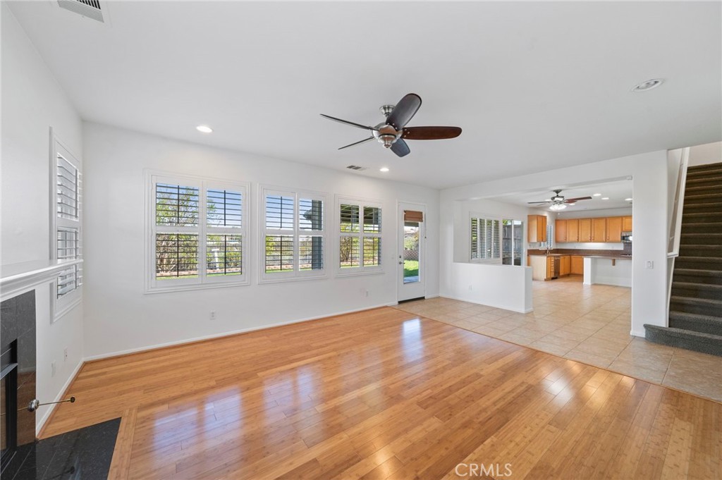 33710 Sattui Street Temecula, CA 92592 - Photo 16 of 75 a view of empty room with wooden floor and fan