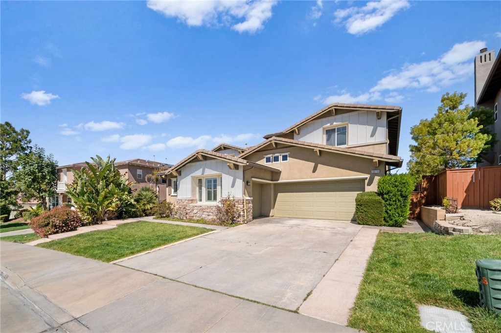 33710 Sattui Street Temecula, CA 92592 - Photo 2 of 75 a front view of a house with a yard