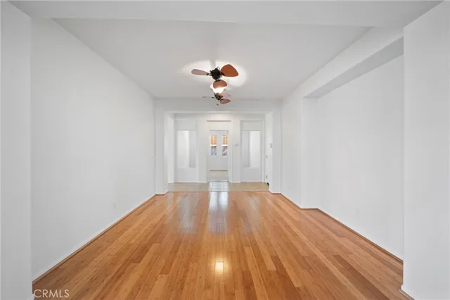 an empty room with windows and pillars in it