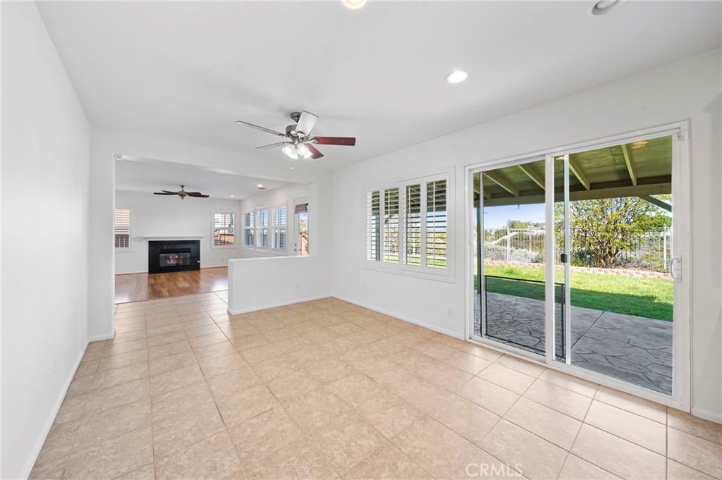 33710 Sattui Street Temecula, CA 92592 - Photo 22 of 75 a view of an empty room with a fireplace and a window