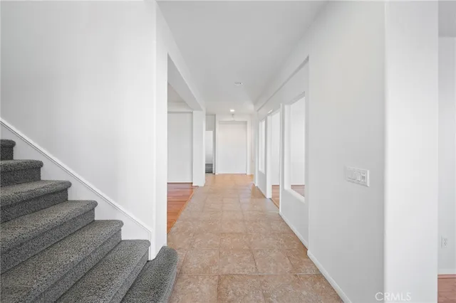 an empty room with a cabinet and a ceiling fan
