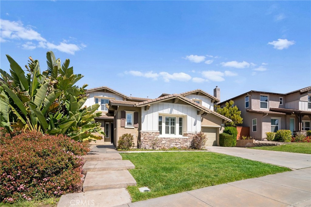 33710 Sattui Street Temecula, CA 92592 - Photo 3 of 75 a front view of a house with a yard and potted plants