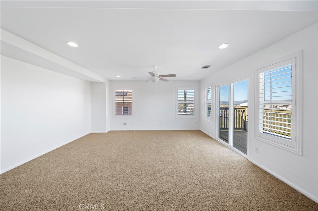 33710 Sattui Street Temecula, CA 92592 - Photo 32 of 75 an empty room with windows and pillars in it