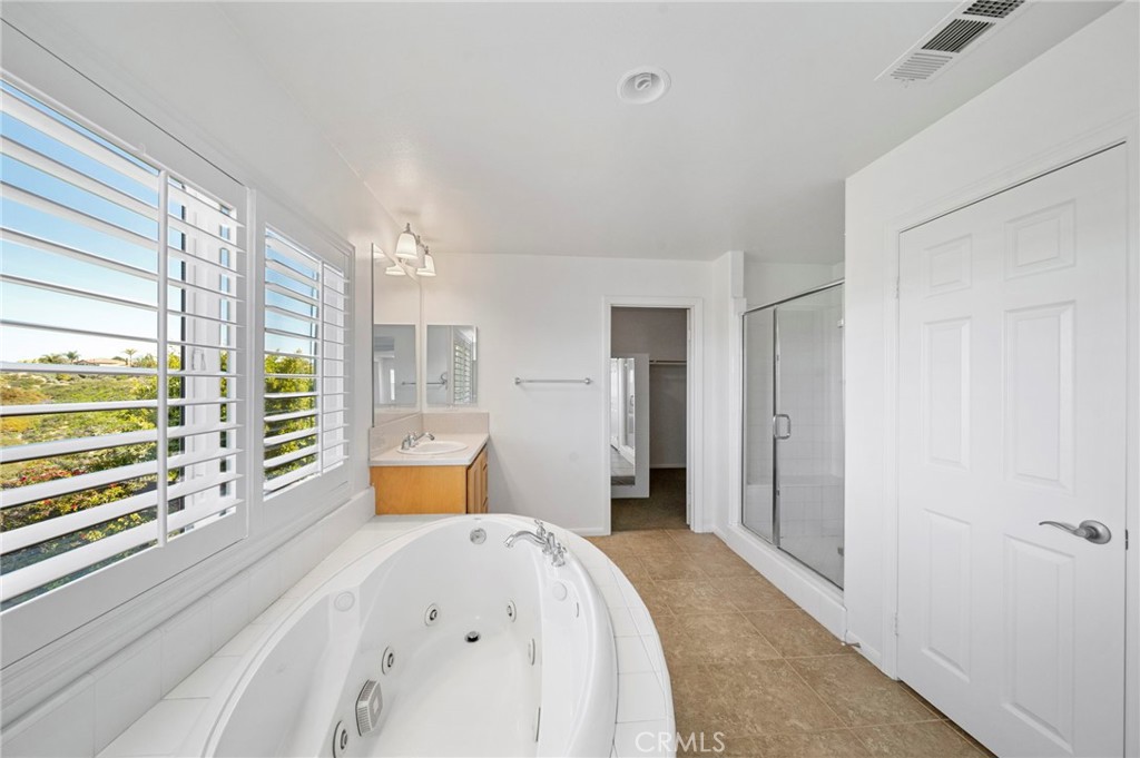 33710 Sattui Street Temecula, CA 92592 - Photo 35 of 75 a bedroom with a bed and wooden floor