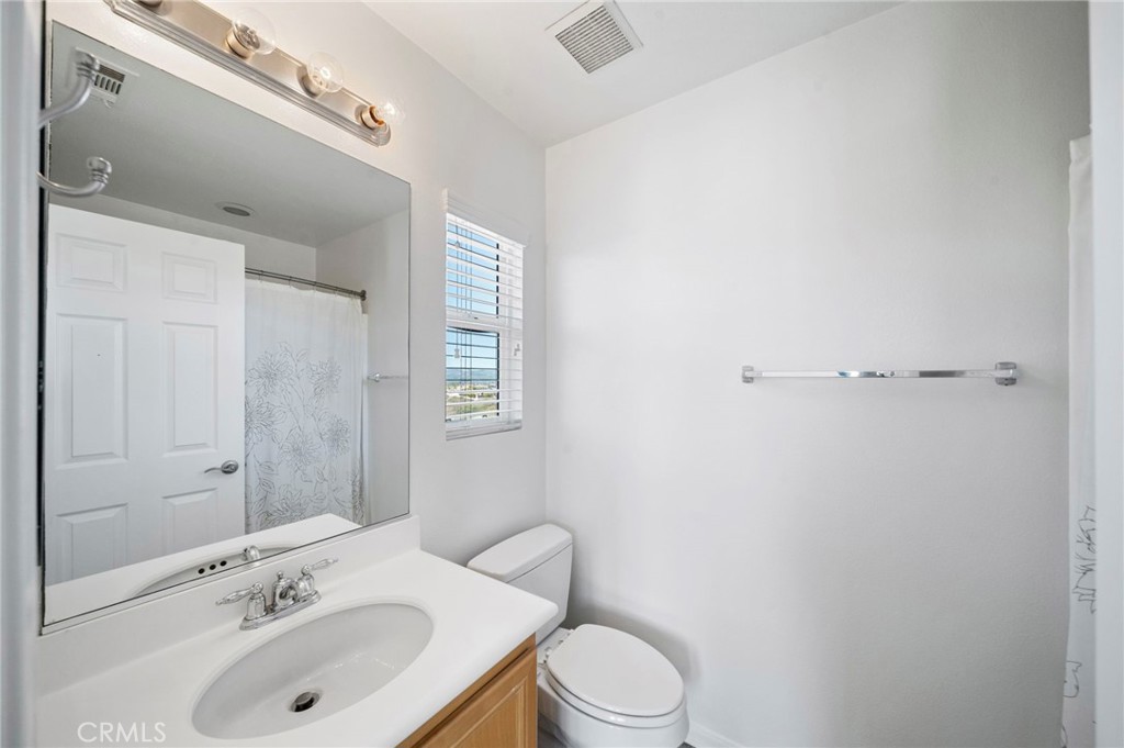 33710 Sattui Street Temecula, CA 92592 - Photo 39 of 75 a bathroom with a sink toilet and shower