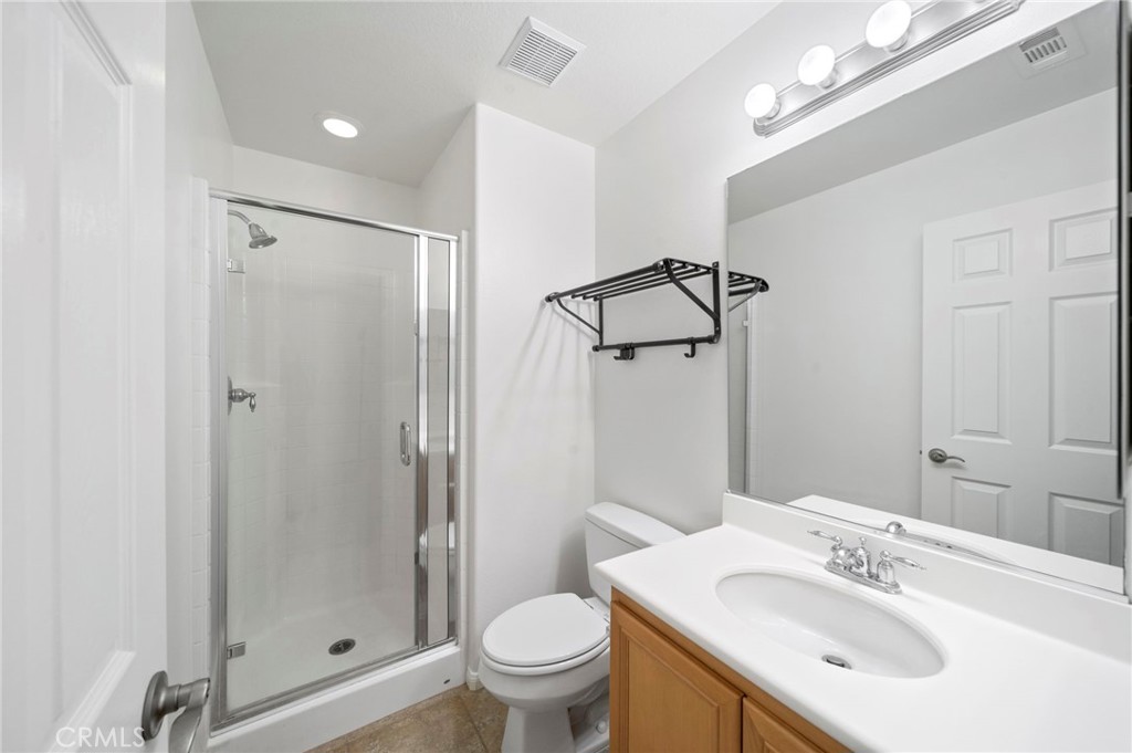 33710 Sattui Street Temecula, CA 92592 - Photo 46 of 75 a bathroom with a sink toilet and shower