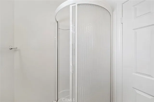 an aerial view of residential house with outdoor space and trees all around