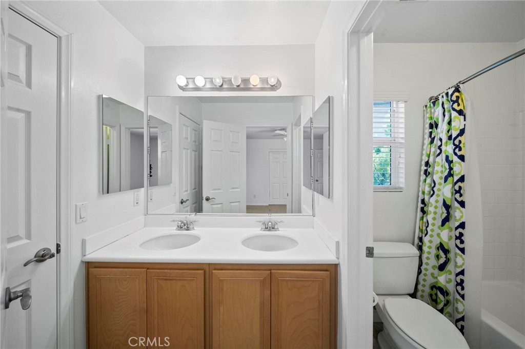33710 Sattui Street Temecula, CA 92592 - Photo 50 of 75 a bathroom with a sink and a mirror