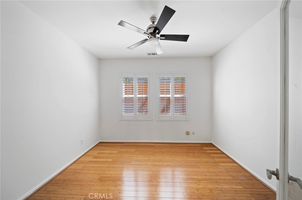 33710 Sattui Street Temecula, CA 92592 - Photo 54 of 75 a view of empty room with wooden floor and fan