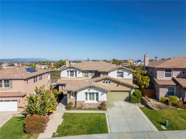 a view of city from a balcony with wooden floor