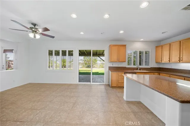 a kitchen with stainless steel appliances granite countertop a sink and a cabinets