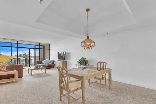a view of a livingroom with furniture and a window