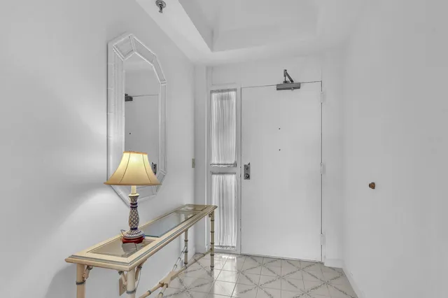 a living room with a table and a chair