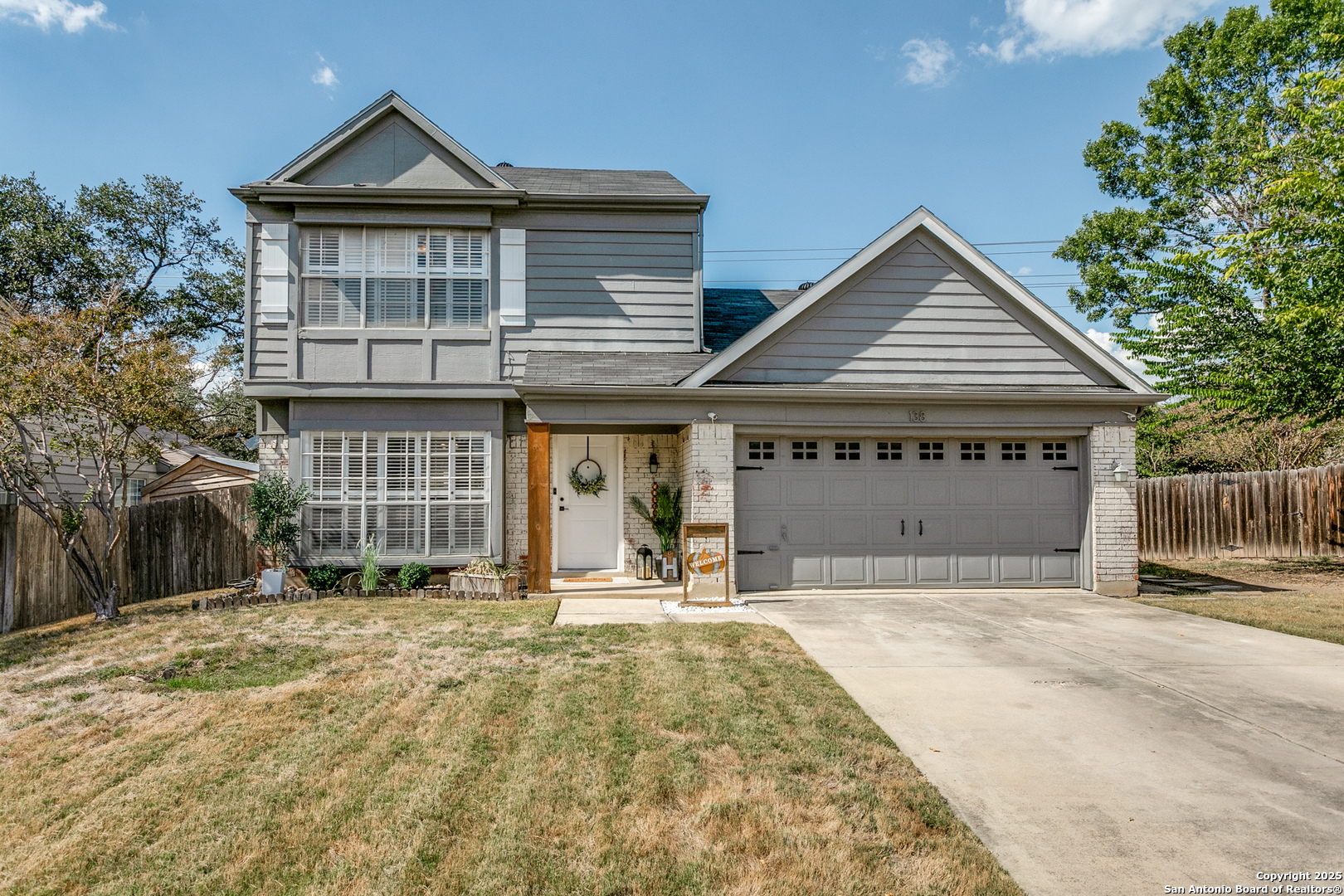 138 Sweetleaf Lane Cibolo, TX 78108 - Photo 1 of 21 a view of a house with large windows and a small yard