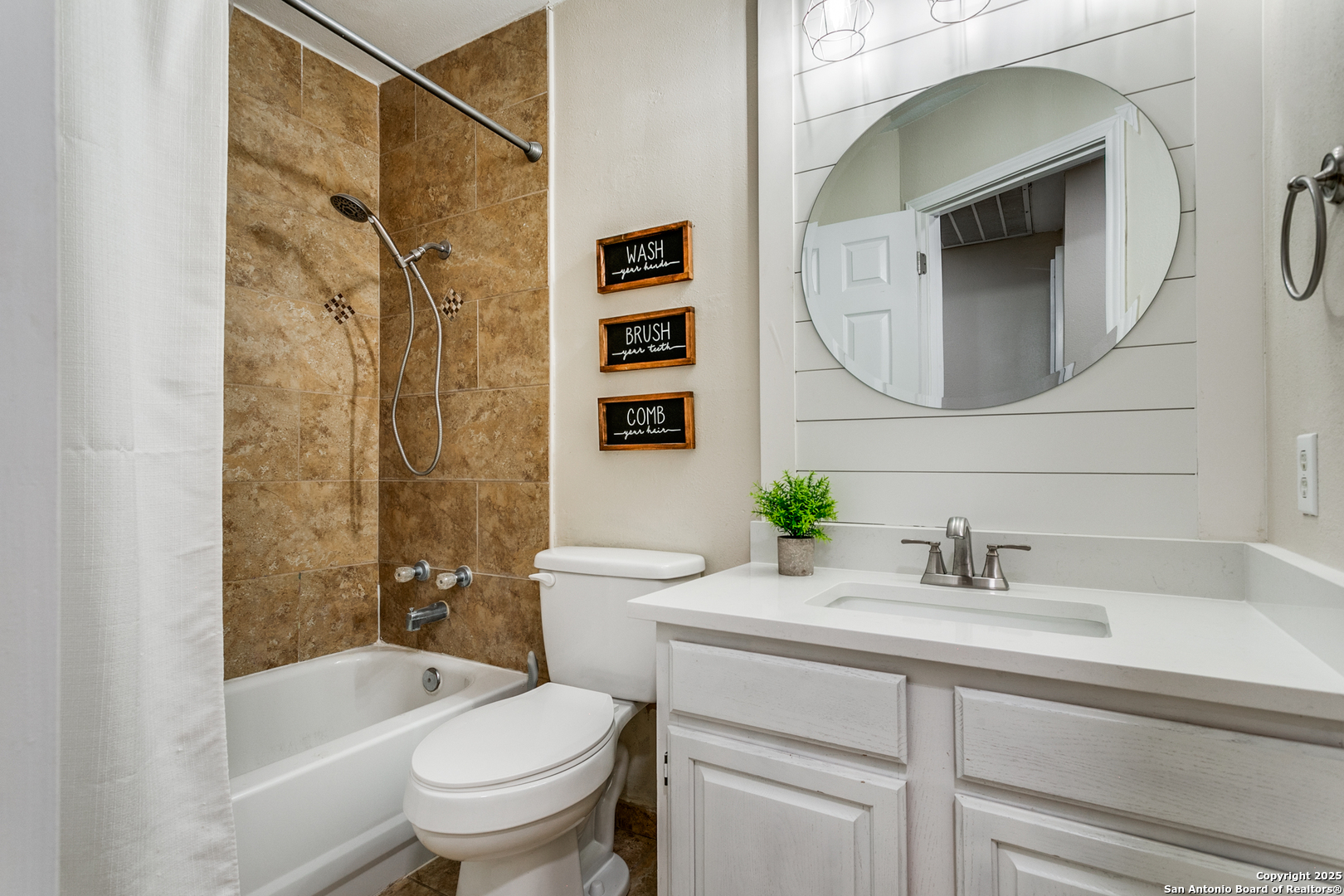 138 Sweetleaf Lane Cibolo, TX 78108 - Photo 16 of 21 a bathroom with a sink a toilet and a mirror