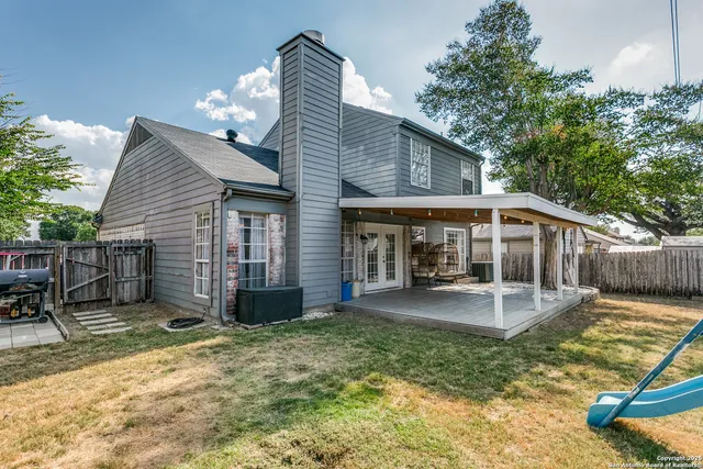 a view of a house with a yard patio and backyard