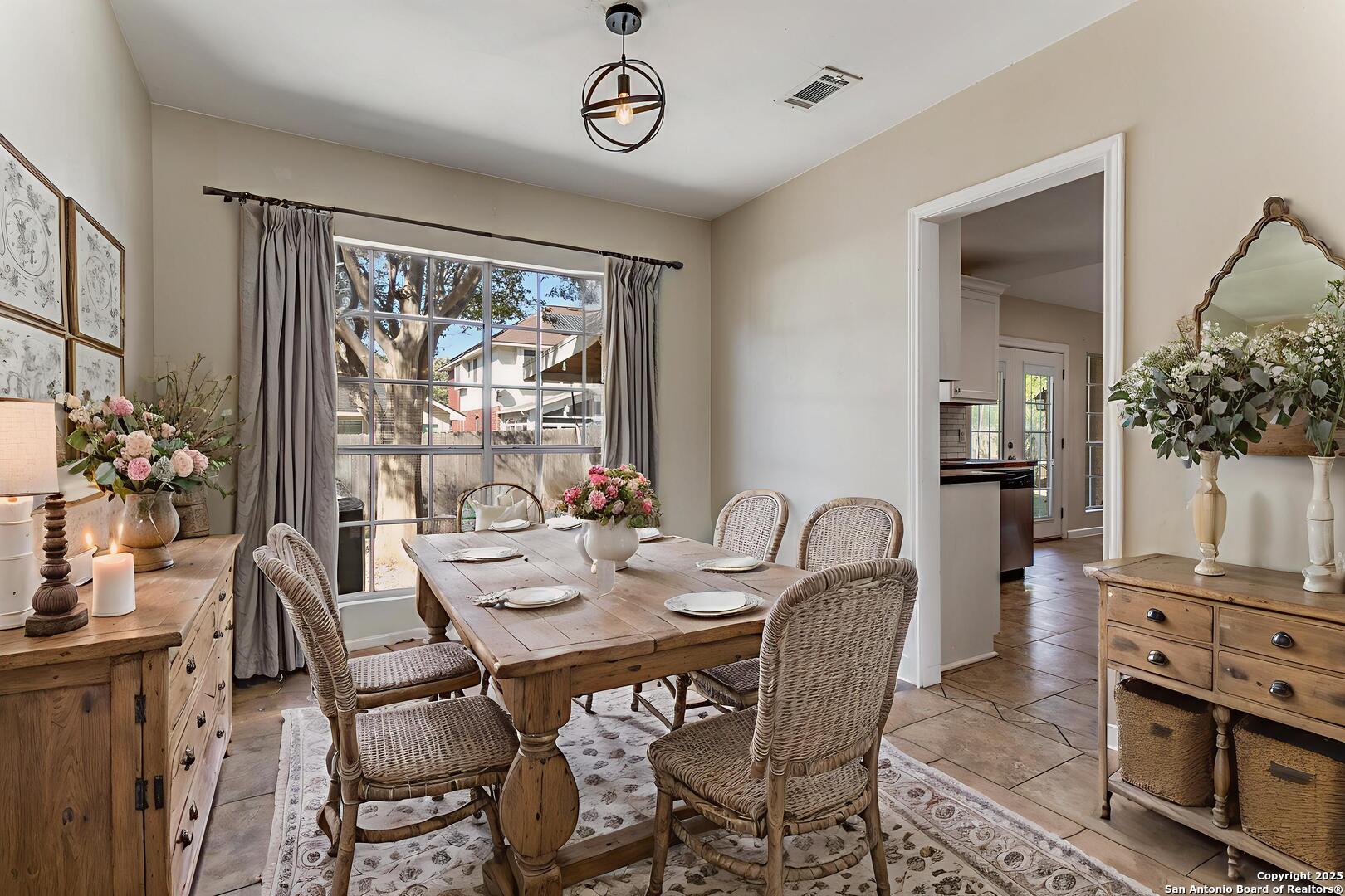 138 Sweetleaf Lane Cibolo, TX 78108 - Photo 4 of 21 a dining room with furniture a flat screen tv and a large window