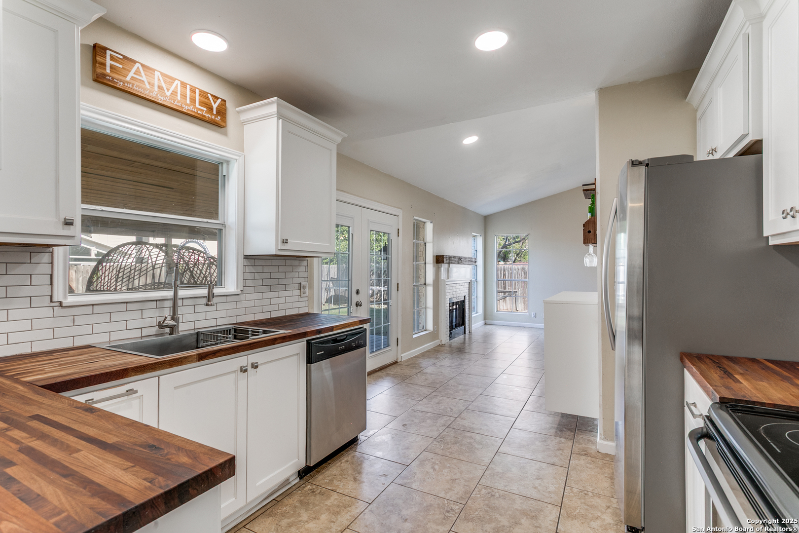138 Sweetleaf Lane Cibolo, TX 78108 - Photo 7 of 21 a kitchen with stainless steel appliances granite countertop a refrigerator and a sink