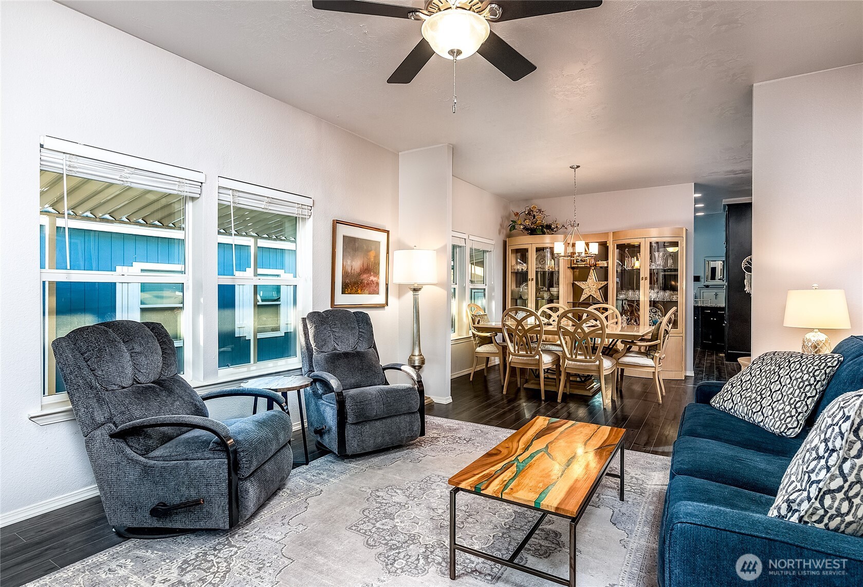 2101 South 324th Street, Unit 53 Federal Way, WA 98003 - Photo 13 of 38 a living room with furniture and a chandelier