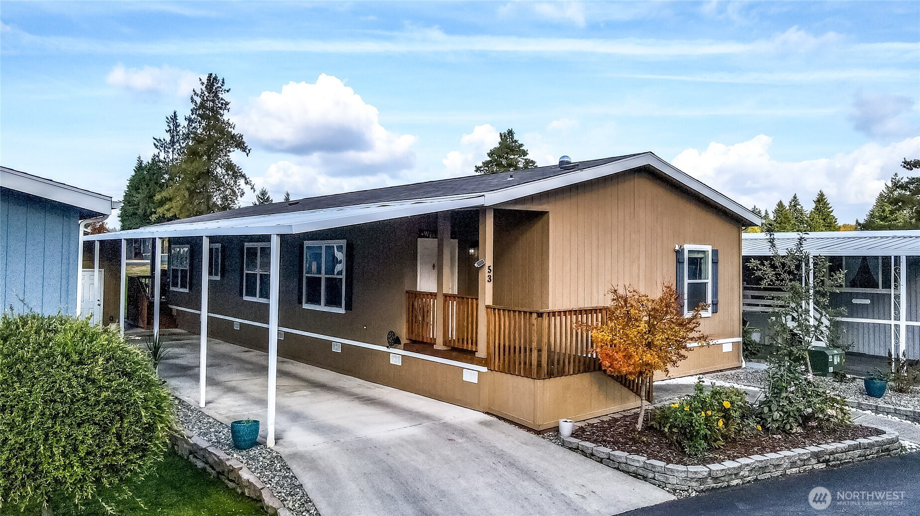 2101 South 324th Street, Unit 53 Federal Way, WA 98003 - Photo 2 of 38 a front view of a house with garden