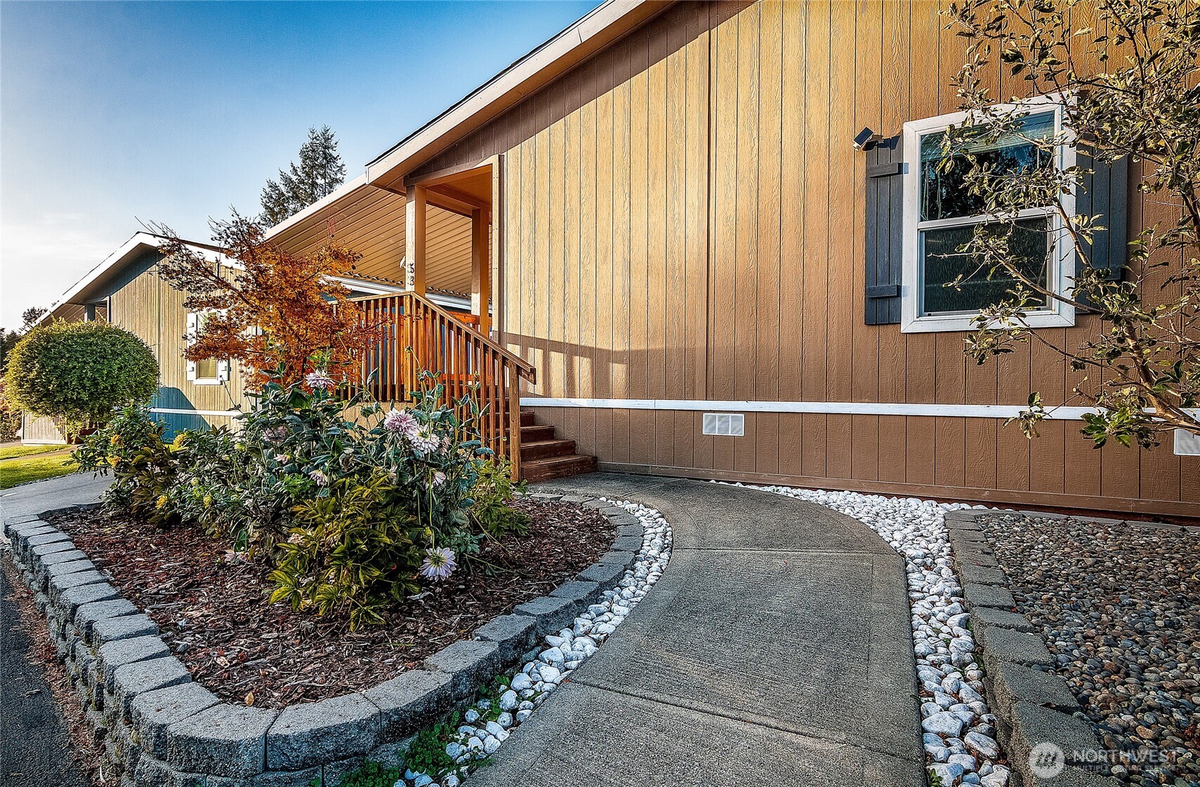2101 South 324th Street, Unit 53 Federal Way, WA 98003 - Photo 25 of 38 a view of backyard with plants and outdoor seating