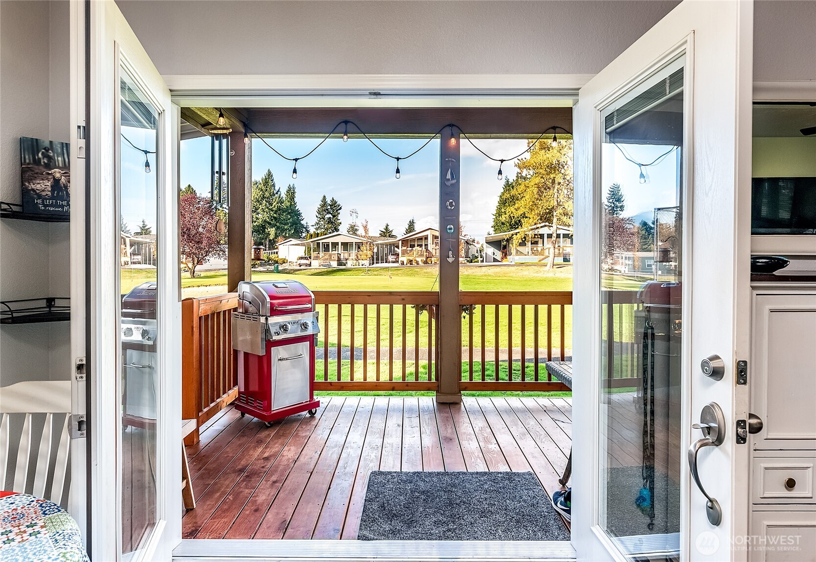 2101 South 324th Street, Unit 53 Federal Way, WA 98003 - Photo 4 of 38 a view of a room with wooden floor and furniture