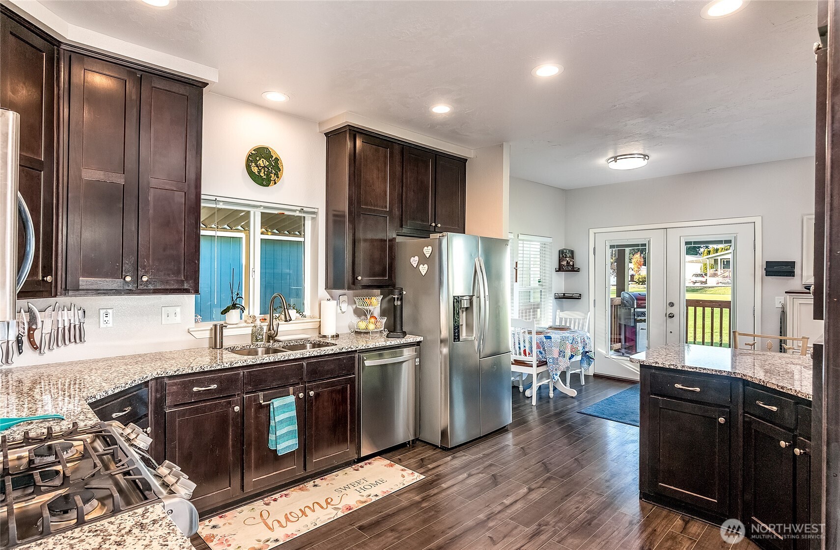 2101 South 324th Street, Unit 53 Federal Way, WA 98003 - Photo 8 of 38 a kitchen with stainless steel appliances granite countertop a sink stove and refrigerator